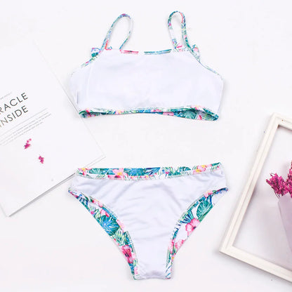 Up-close of the bow detail and print on girls' stylish and quick-dry bikini swimwear