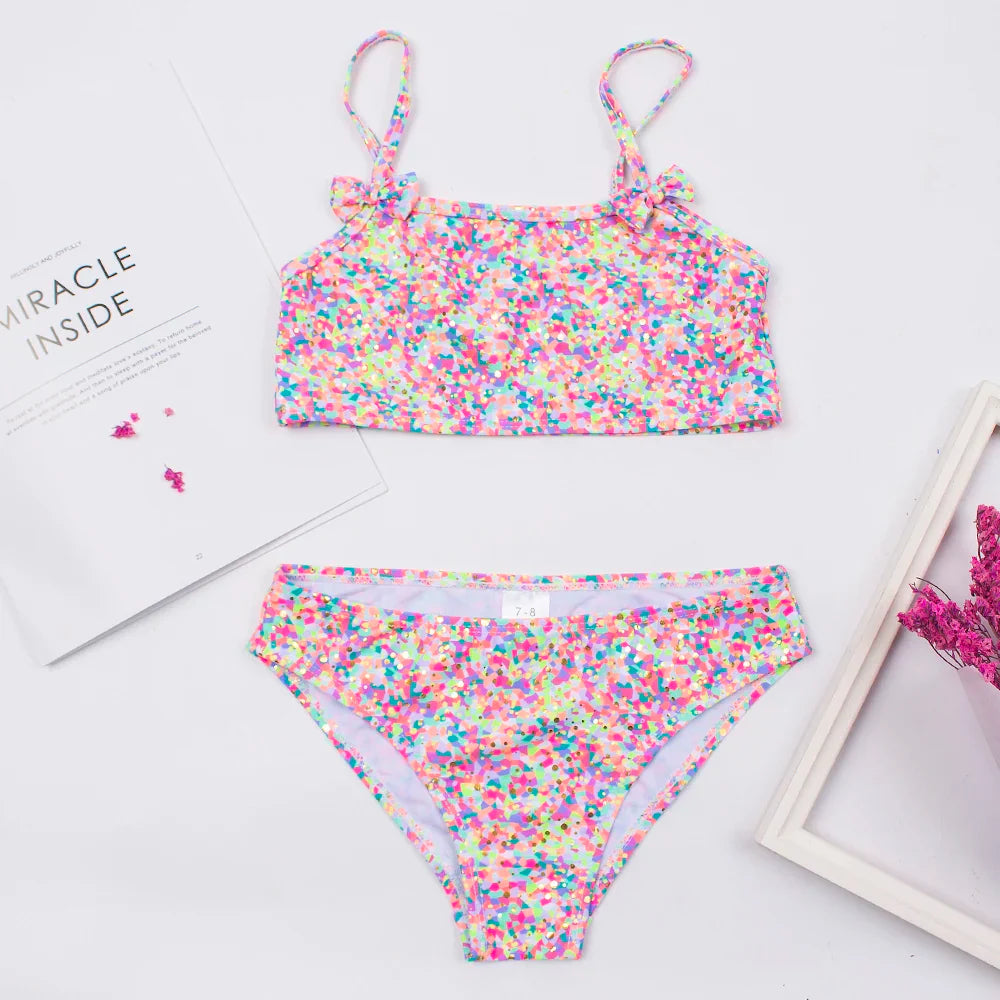 Assorted girls' print bikini sets with bow decorations, multi-style kids beachwear options