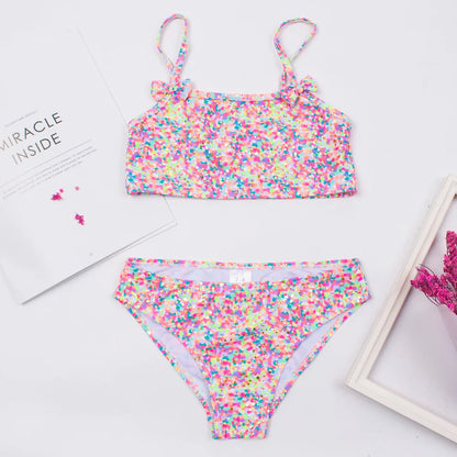 Assorted girls' print bikini sets with bow decorations, multi-style kids beachwear options