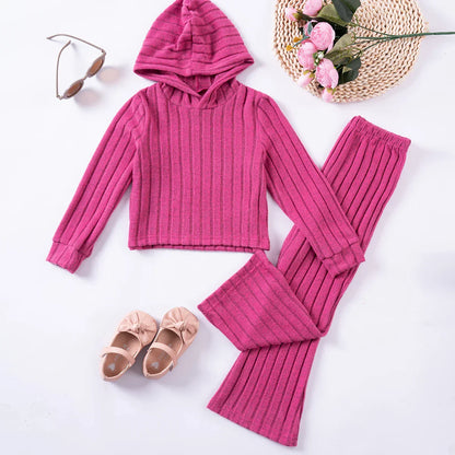 Close-up of a pink girls' tracksuit jacket, warm polyester, perfect for cozy winter wear.