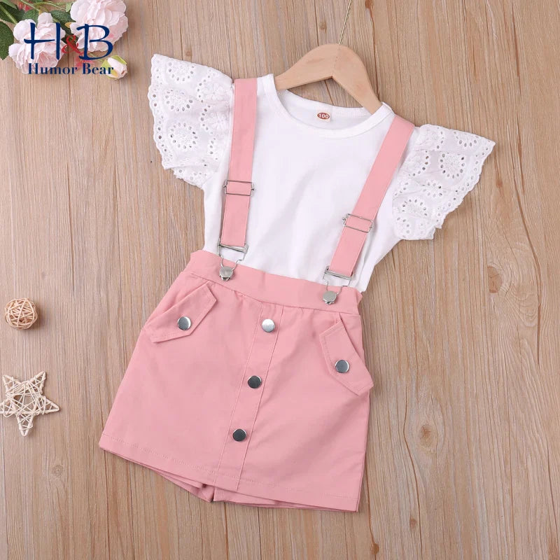 Girls' princess fashion shorts set laid flat: pink pullover top & matching shorts, comfy cotton blend for summer.