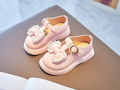 Back view of girls princess flats in pink, highlighting the elegant bow-knot and pearl details.