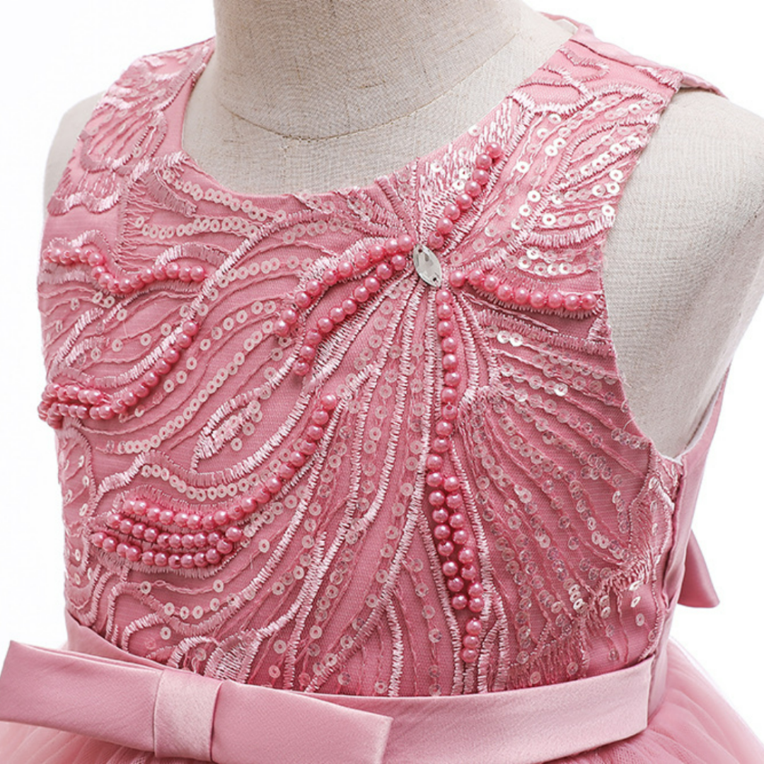 Full view of a girls' sleeveless ball gown princess dress adorned with pearls and sequins