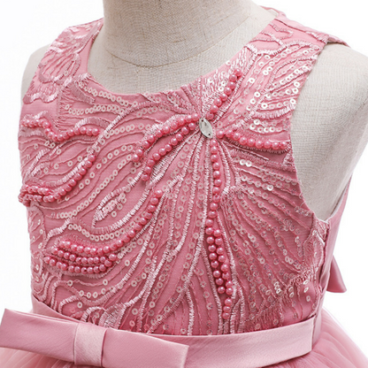 Full view of a girls' sleeveless ball gown princess dress adorned with pearls and sequins