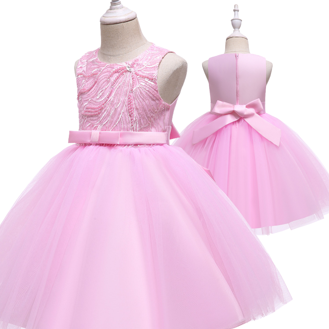 Toddler girl in a beautiful pearl and sequin embellished princess party dress, ready for celebration