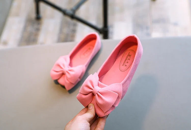 Purple toddler sandals with a charming bowtie, designed for breathability and comfort