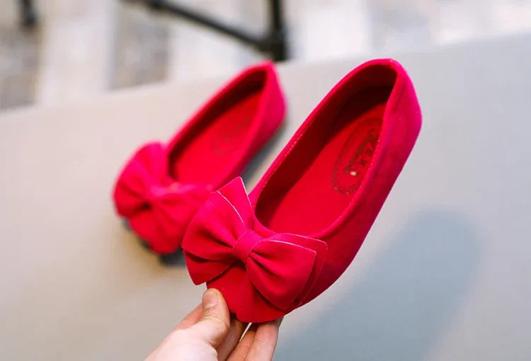 Close up of the non-slip sole of a girls' yellow bowtie slip-on sandal for safety