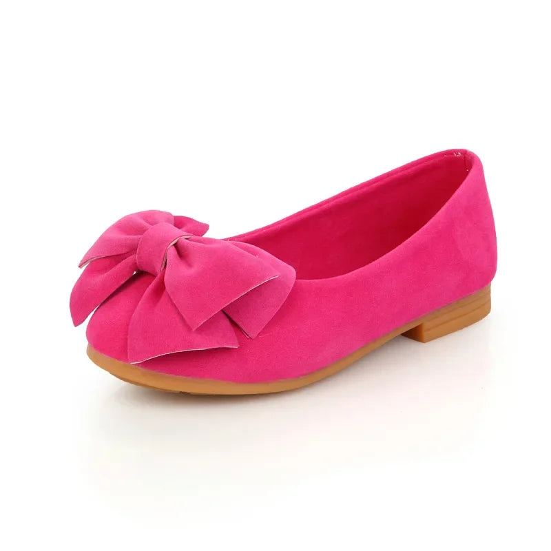 Pair of black girls' fashion sandals with large bowties, simple yet elegant slip-on style