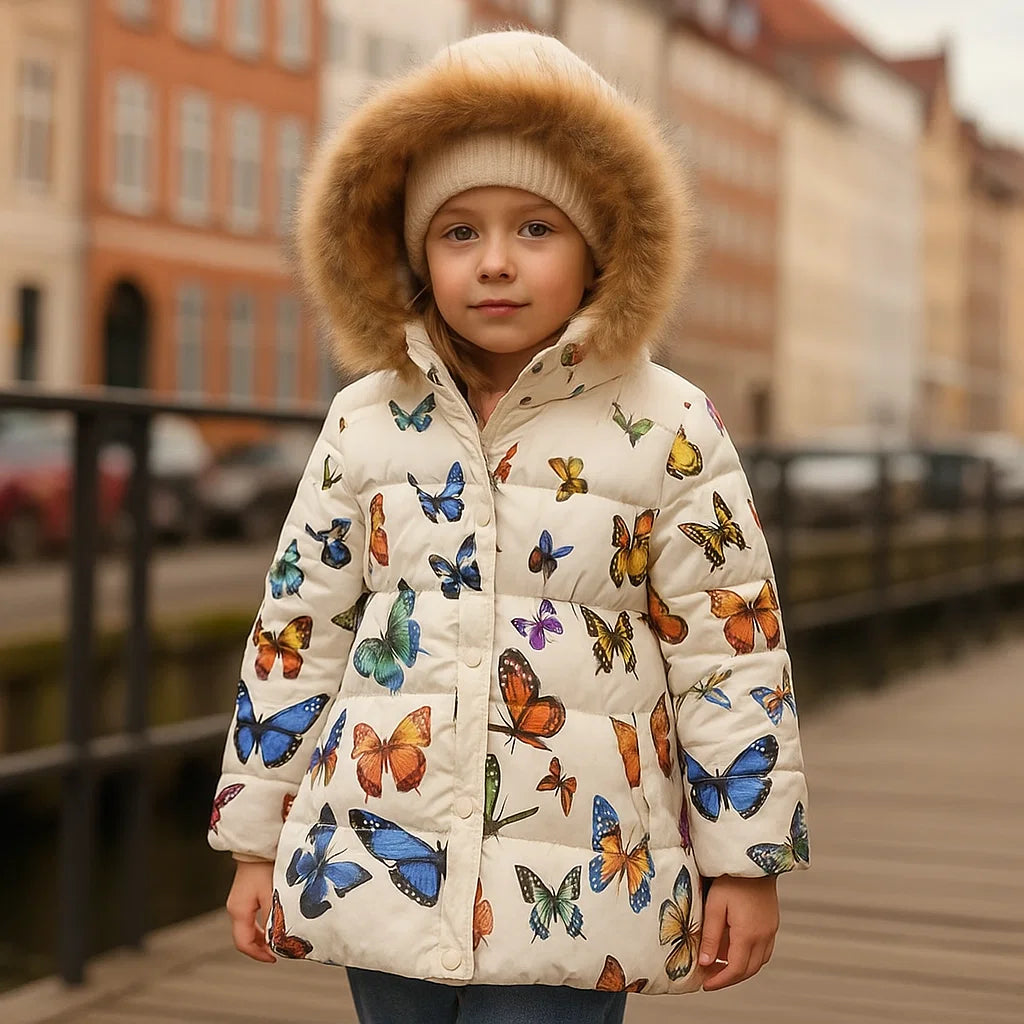 Warm girls' puffer jacket in blue with star patterns, ideal kids' winter outerwear.