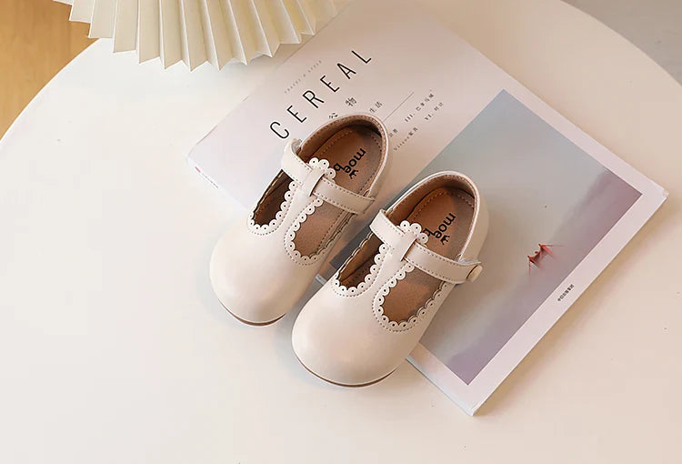 Front view of girls' red retro T-strap flats, vintage princess dress shoes, elegant kids footwear