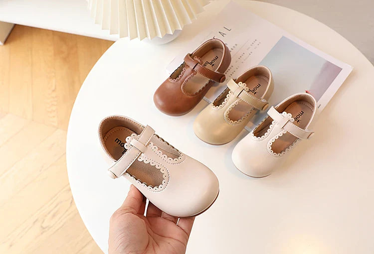 Girls' retro T-strap flats in a group, various colors, vintage princess dress shoes collection