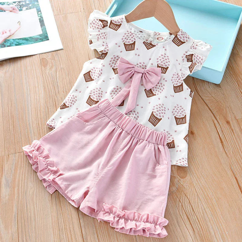 Children's playwear: Sleeveless top and shorts with vibrant ice cream print & bow detail