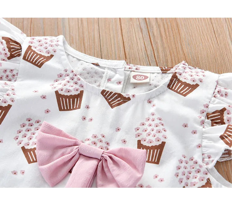 Girls' stylish sleeveless summer outfit in pink with an ice cream motif and large bow