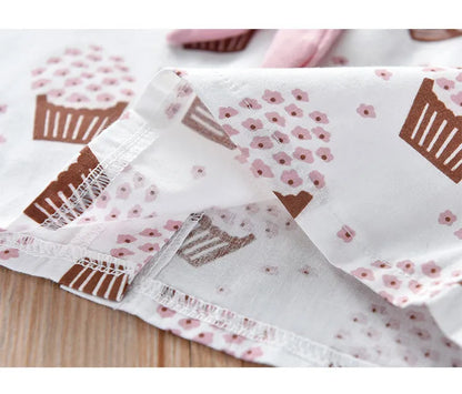 Girls' summer essentials: Sleeveless top, bow shorts, and fun ice cream pattern in pink