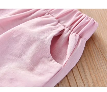 Animated flat lay of girls' pink sleeveless ice cream and bow summer outfit for children