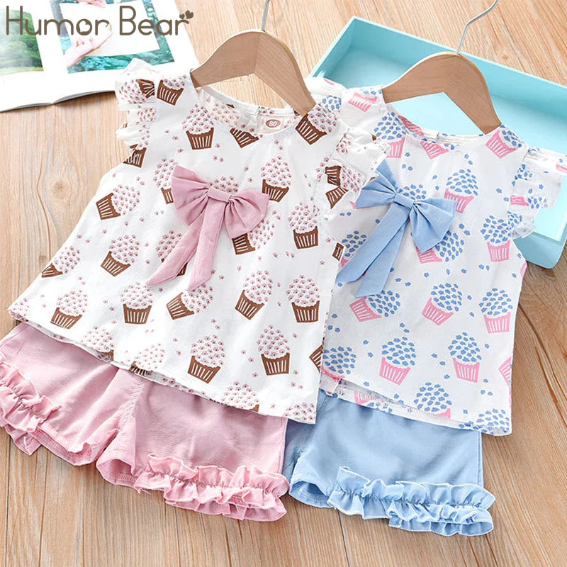 Children's apparel: Sleeveless top and shorts set featuring ice cream pattern and bow detail