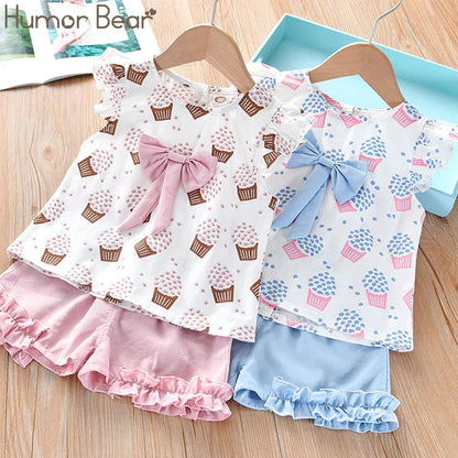 Children's apparel: Sleeveless top and shorts set featuring ice cream pattern and bow detail