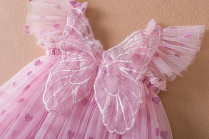 Chic purple girls' party dress, a winged tulle design with a statement back bow for toddlers.