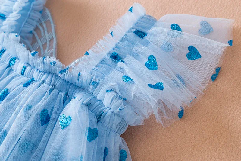 Stylish light blue girls' birthday dress, a tulle creation with a back bow and lovely wing details.