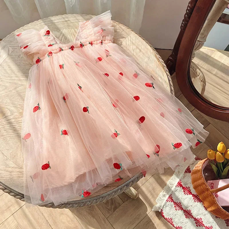 A white back bow wing tulle party dress for girls, a classic and timeless birthday outfit.