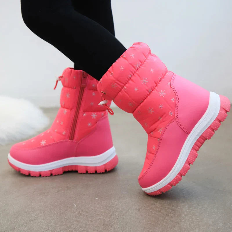 Pair of girls' blue waterproof winter boots, offering warmth and traction for cold.