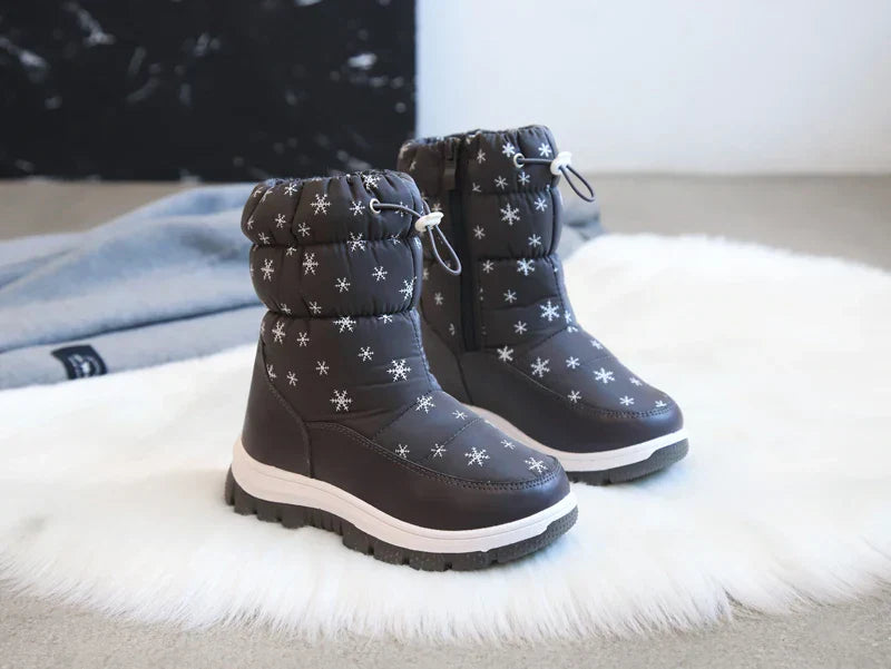 Collection of colorful waterproof winter snow boots for girls, various sizes.