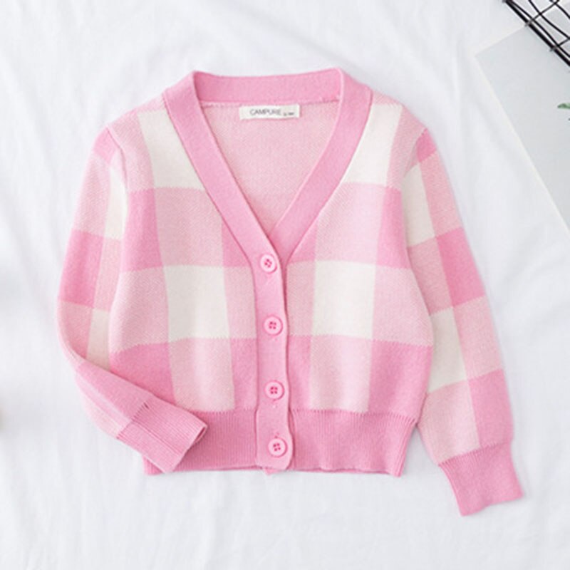 Folded girls' rainbow cloud knitted cardigan, ready for cool weather or fall fashion.