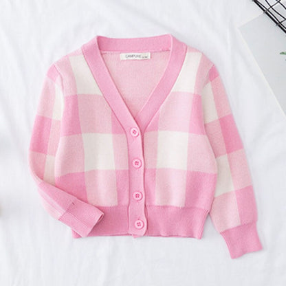 Folded girls' rainbow cloud knitted cardigan, ready for cool weather or fall fashion.