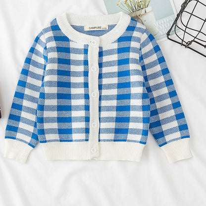 Detail of the buttons on the rainbow cloud knitted cardigan, functional and adorable for kids.