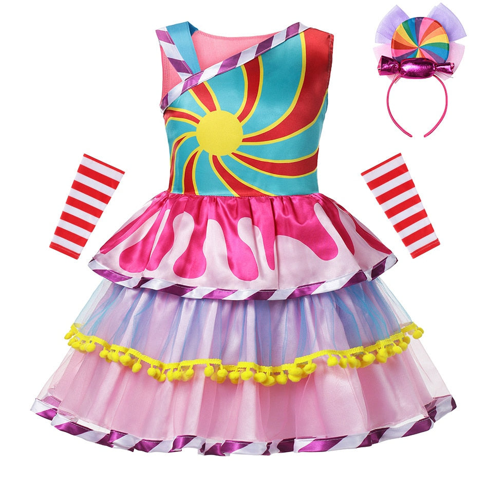 Close-up of a whimsical girls' rainbow swirl candy party dress fabric with a coordinating headband