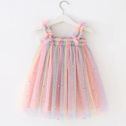 Close-up of a girls' rainbow unicorn tulle princess dress, highlighting the horn and ear details.