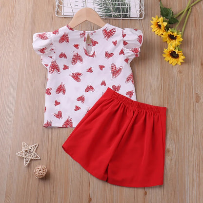 Cute toddler girl in heart print two-piece summer outfit, comfortable kids wear