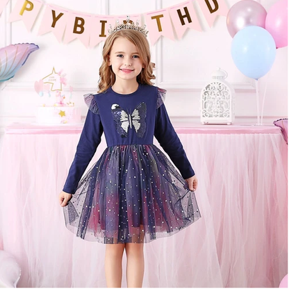 Close-up of sequin butterfly detail on a long sleeve pink princess dress for girls, kids fashion