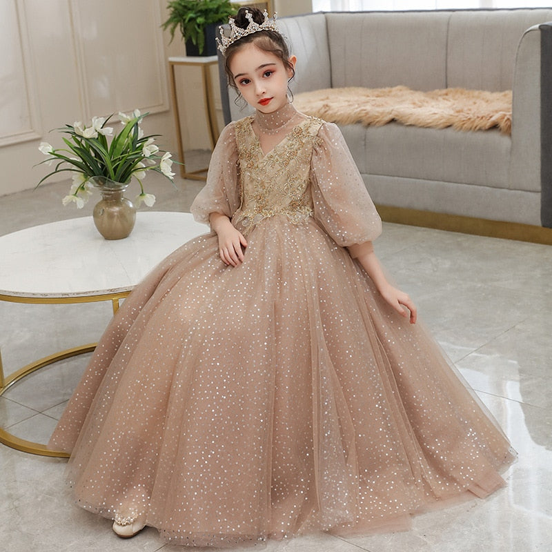 Close-up of sparkling sequin bodice on a girls' formal gown with delicate puff sleeves