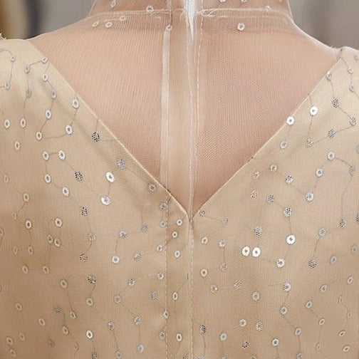 Back view of a girls' A-line puff sleeve formal gown with sequin top, ideal for flower girl