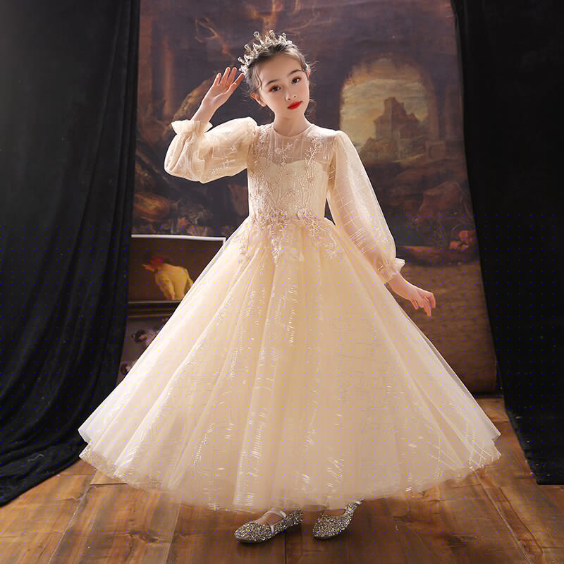Child's formal sequin dress featuring charming puff sleeves and flowing A-line skirt