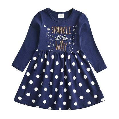 Little girl happily wearing a sequin rabbit long sleeve dress, a fun toddler dress option.