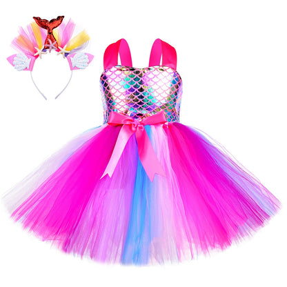 Kids fashion: close-up of a glittery mermaid princess party dress fabric and scales, paired with a headband.