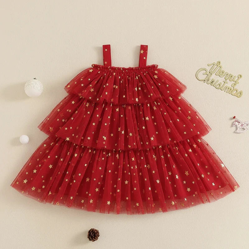 Close-up of shimmering star fabric on a girls' elegant holiday party dress