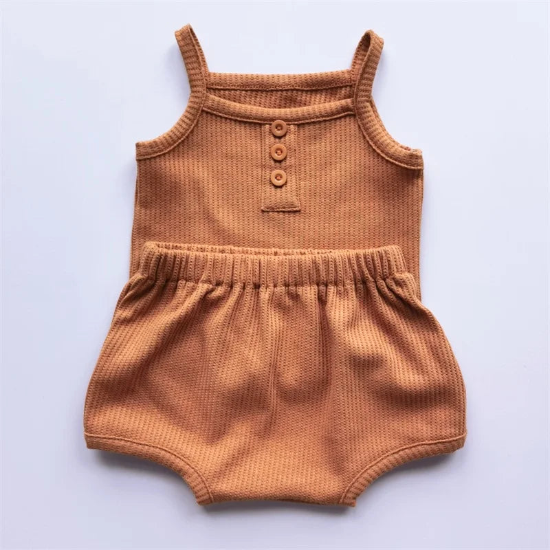 Pack of multi-colored girls' sleeveless cotton tops and shorts sets for baby clothing