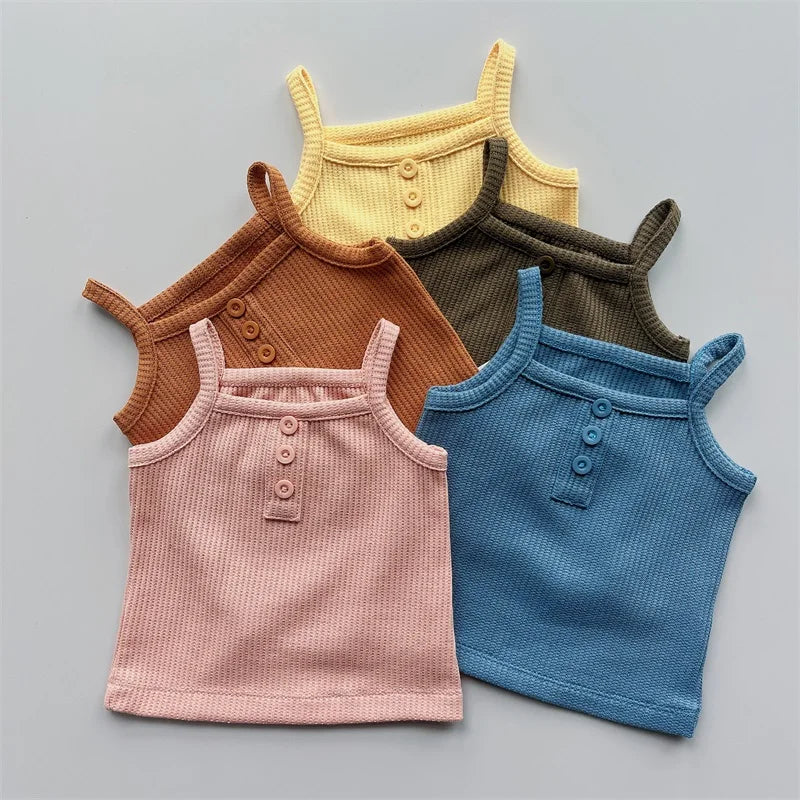 Cute toddler girl in a soft cotton sleeveless top and matching shorts, ideal for warm weather
