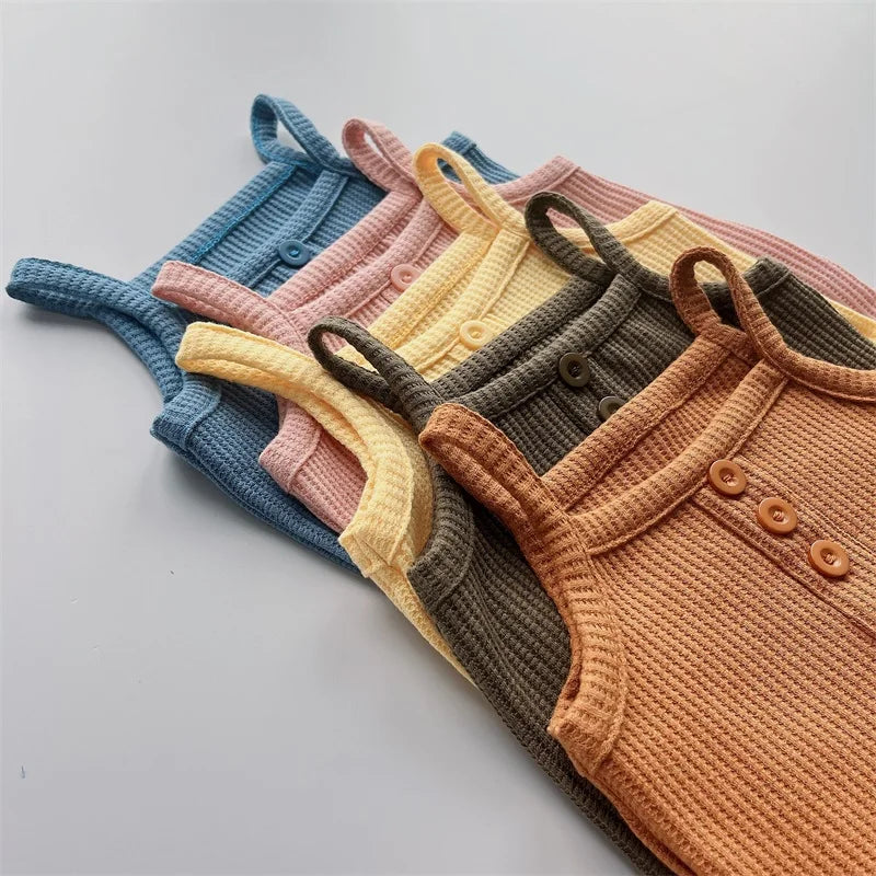 Close-up of the breathable cotton fabric of a girls' sleeveless summer outfit