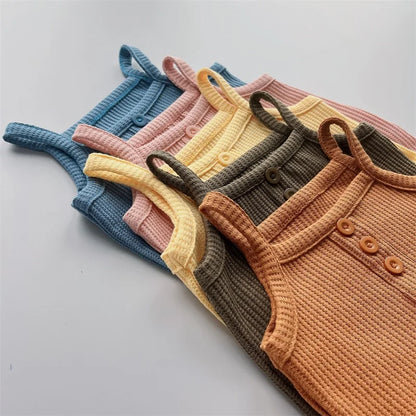 Close-up of the breathable cotton fabric of a girls' sleeveless summer outfit