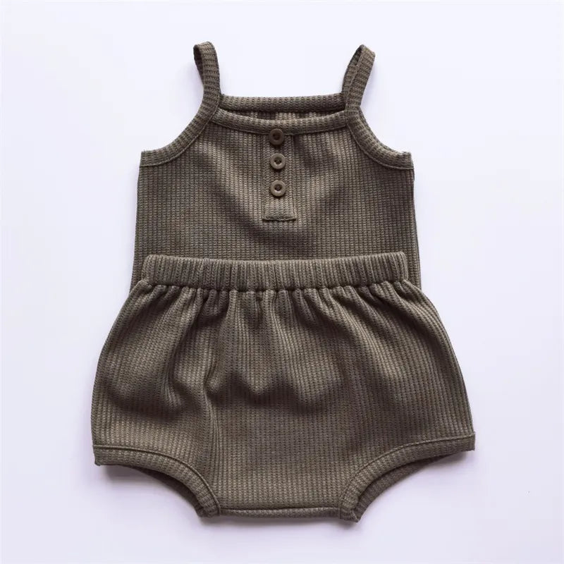 Girls' cotton sleeveless top with a charming print paired with solid shorts