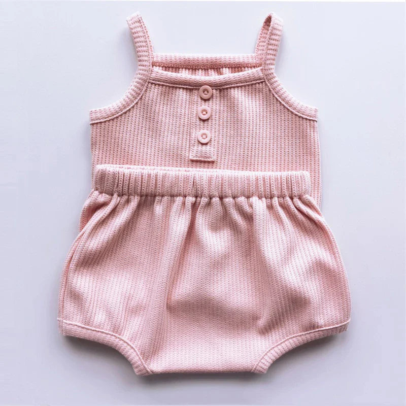 Back view of a baby girl wearing a comfortable and soft cotton sleeveless set