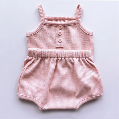 Back view of a baby girl wearing a comfortable and soft cotton sleeveless set