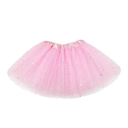 Close-up of sparkling girls' tutu skirt fabric in pink, showing glitter detail & soft mesh layers