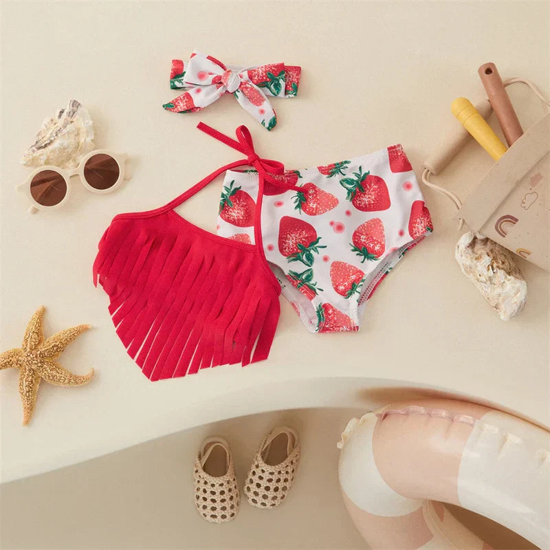 Toddler girl in a cute strawberry bikini with ruffle details and coordinated hairband, polyester swimwear