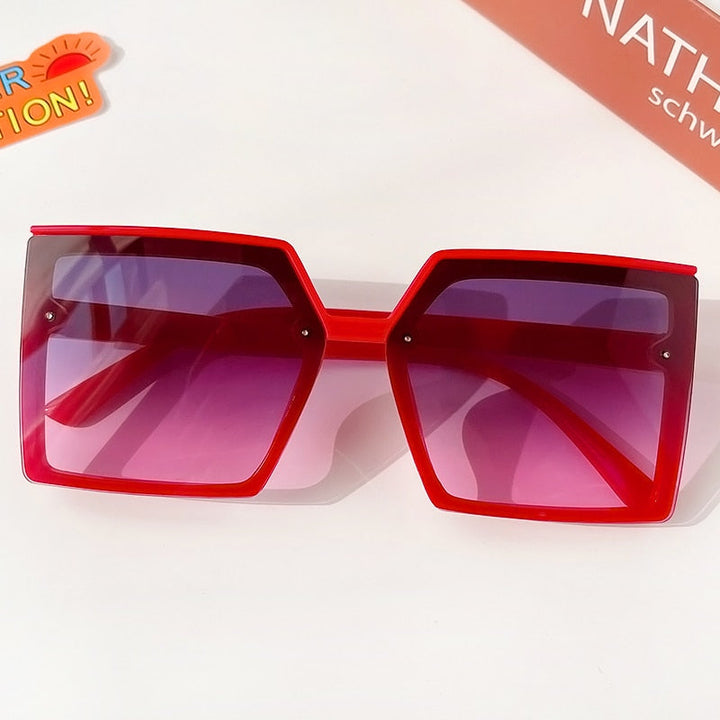 Geometric frame girls' sunglasses, stylish and comfortable kids' eyewear with UV protection.