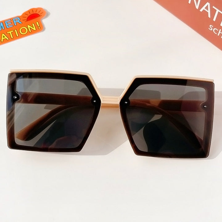 Perfect outdoor accessory: geometric girls' sunglasses, offering stylish sun protection for kids.